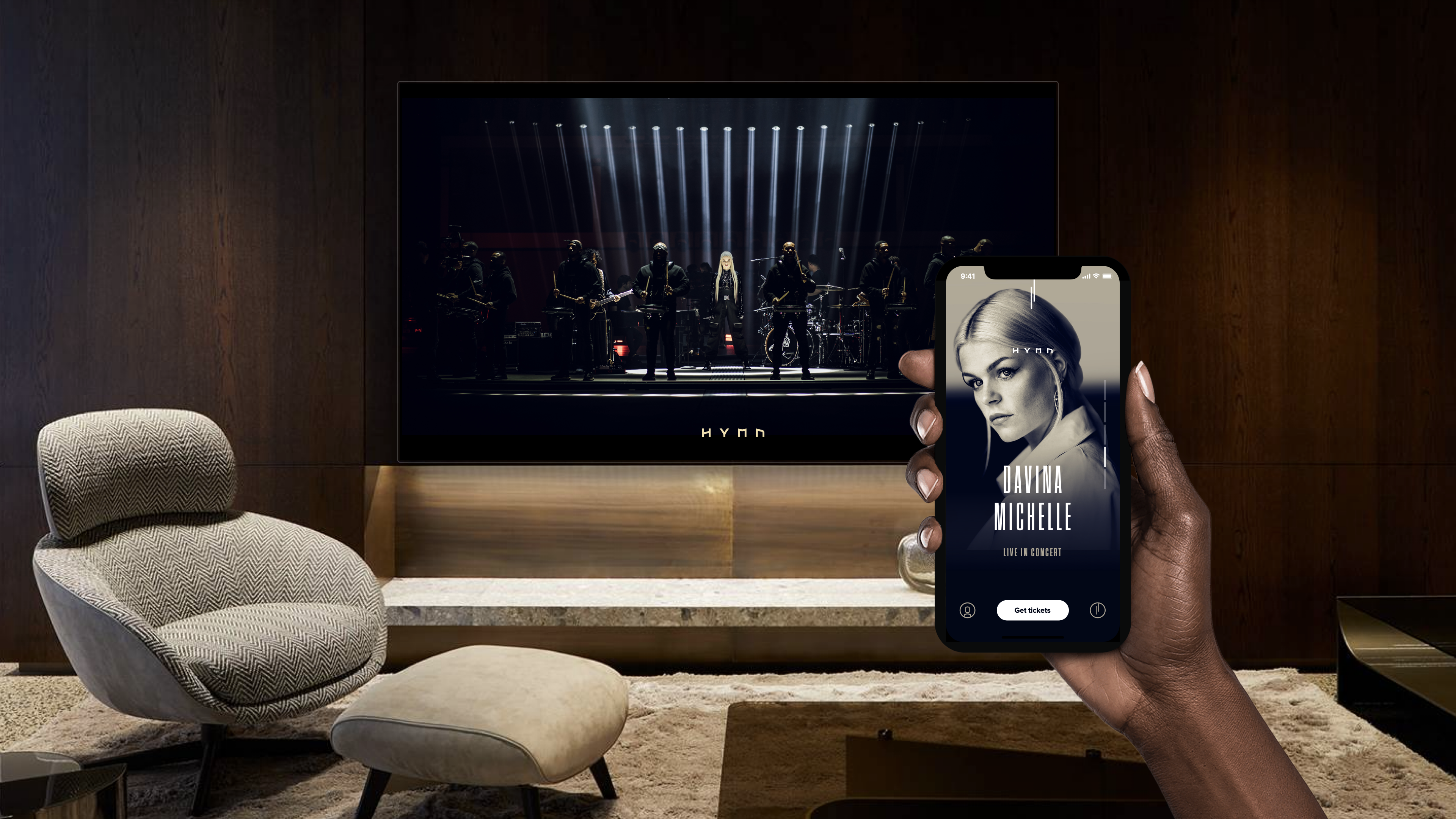 Lounge with TV displaying show and hand holding device with app - mobile