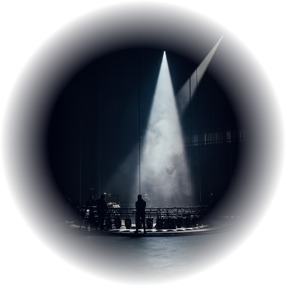 Spotlight onto stage in hazy air